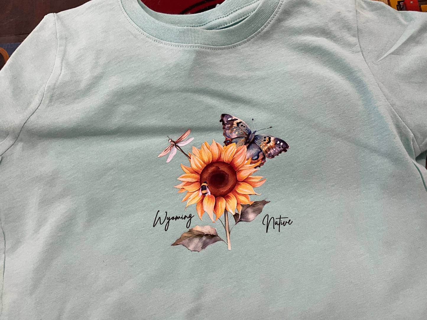 SWIFTWEAR- SS T “WYO NATIVE” SUNFLOWER/BUTTERFLY- RS3321WYO